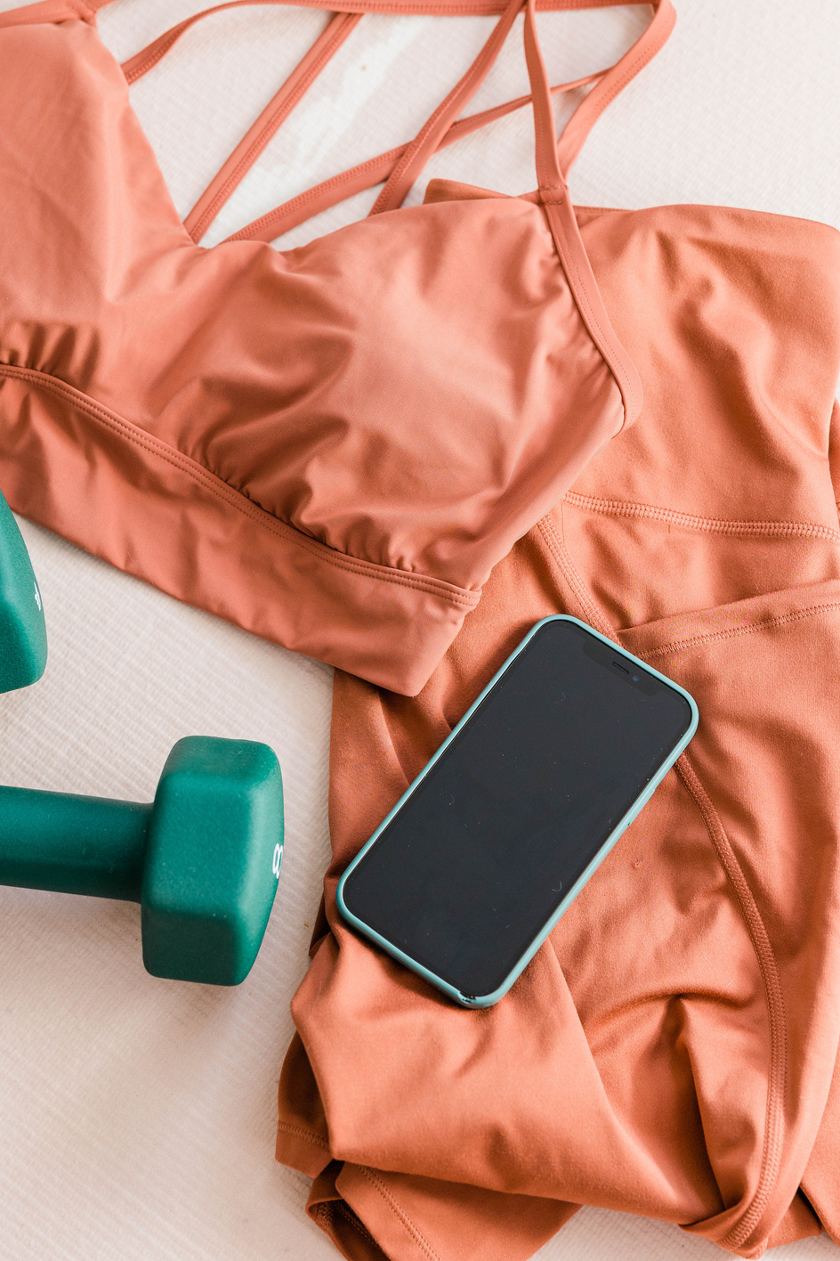Workout Clothes, Dumbbells, and Smartphone